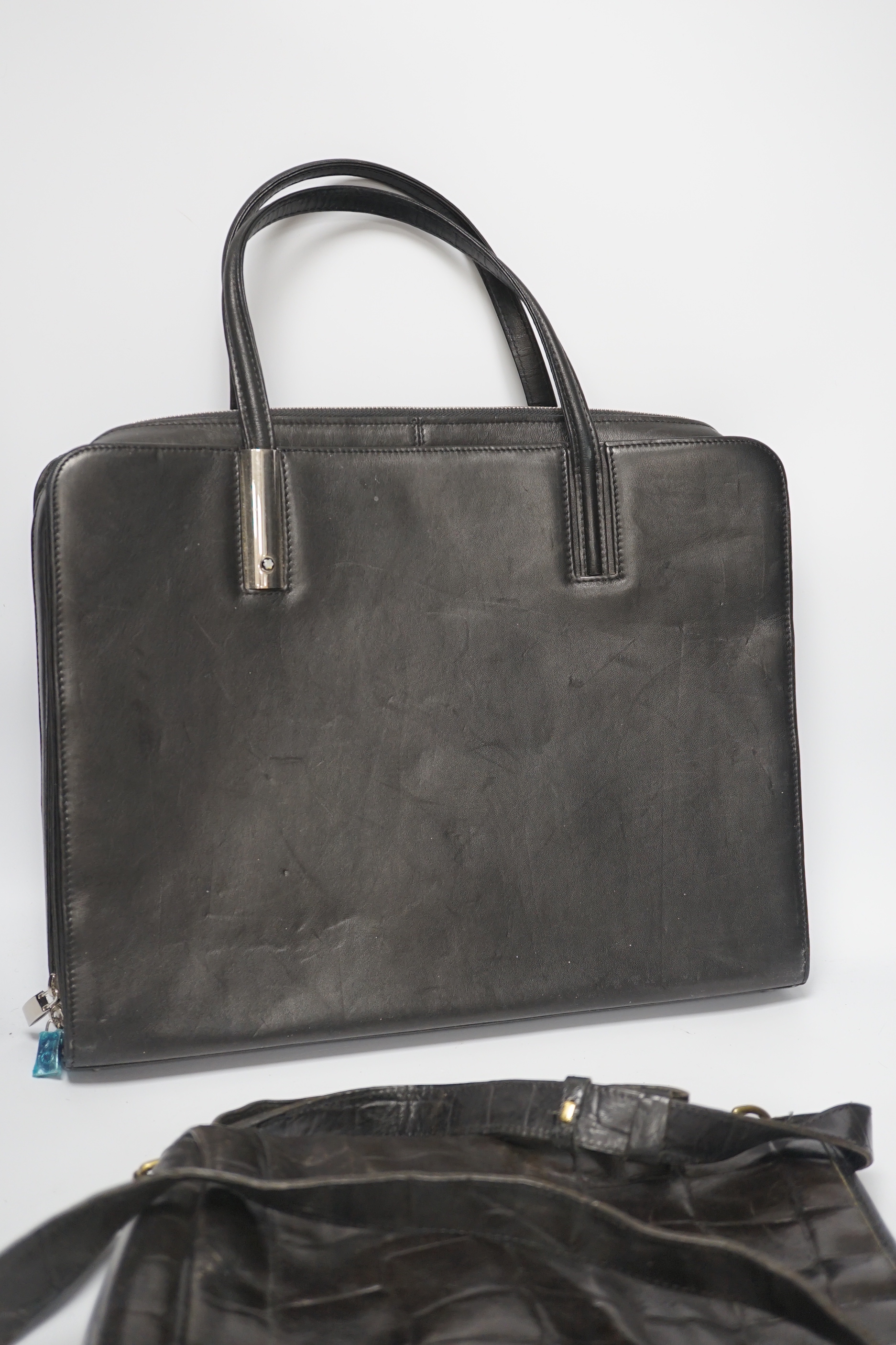 A Mont Blanc leather briefcase and a Mulberry bag with dust cover